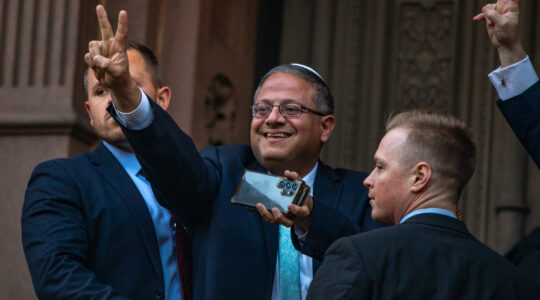 An Israeli politician flashes a peace sign